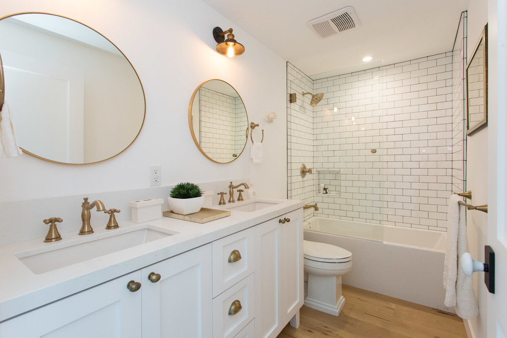 Farmhouse kids' white tile alcove bathtub photo in Los Angeles with shaker cabinets, white cabinets and white walls