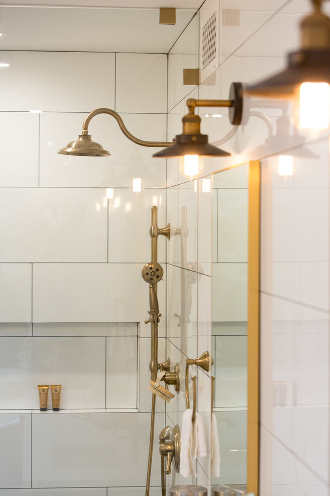 Cottage master white tile claw-foot bathtub photo in Los Angeles with shaker cabinets, black cabinets and white walls