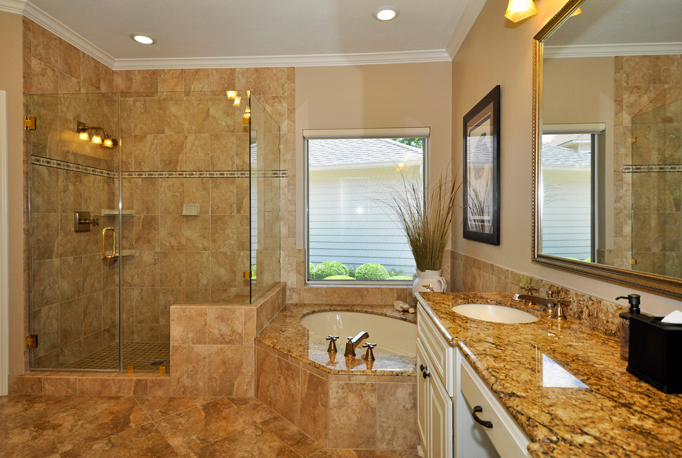 Corner shower - large traditional master beige tile and ceramic tile travertine floor corner shower idea in Houston with an undermount sink, raised-panel cabinets, white cabinets, beige walls, laminate countertops and an undermount tub