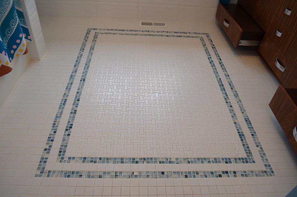 Example of a mid-sized trendy kids' white tile and ceramic tile ceramic tile bathroom design in Minneapolis with an undermount sink, flat-panel cabinets, medium tone wood cabinets, quartz countertops, a one-piece toilet and blue walls