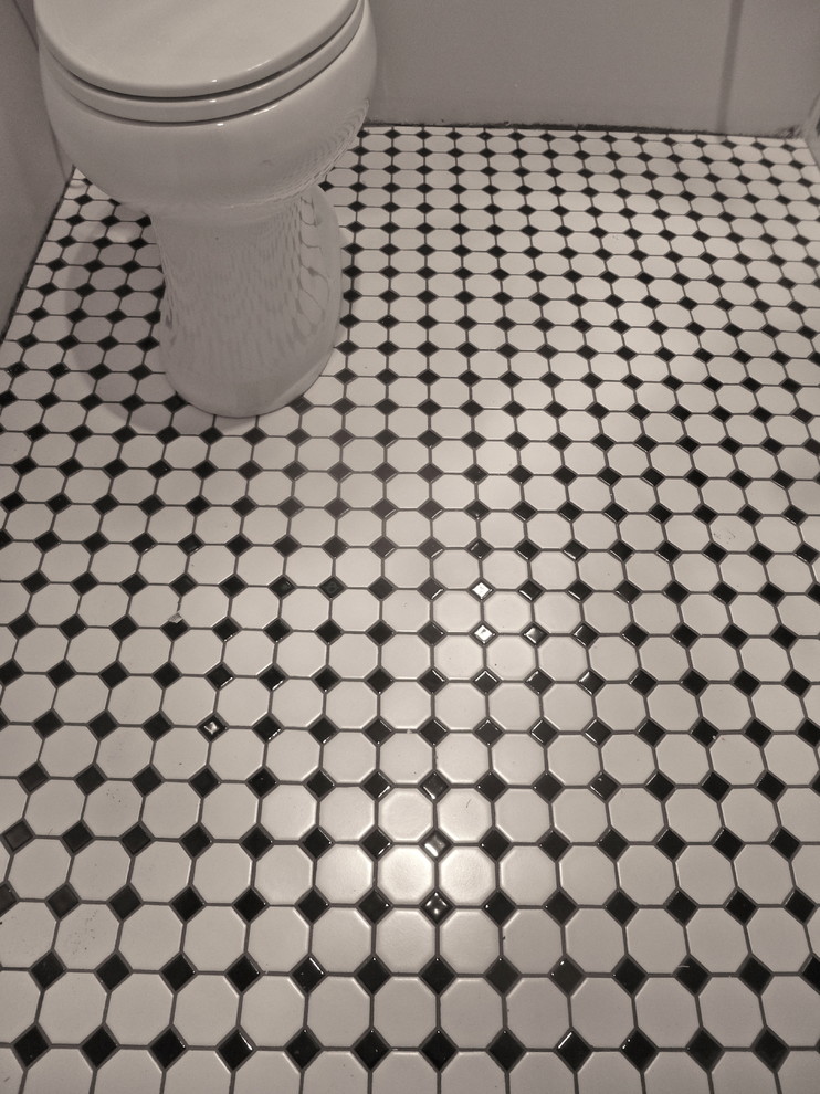 Bathroom - traditional master porcelain tile porcelain tile bathroom idea in Seattle