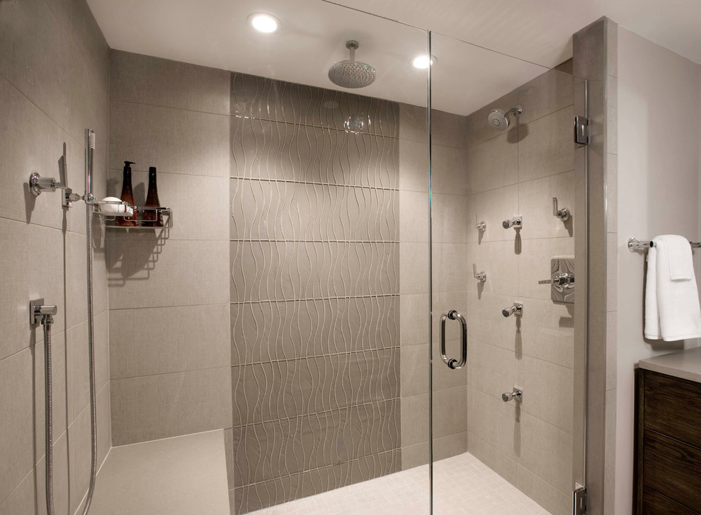 Inspiration for a large modern ensuite bathroom in Boston with a submerged sink, flat-panel cabinets, dark wood cabinets, engineered stone worktops, a double shower, beige tiles, porcelain tiles, beige walls and porcelain flooring.