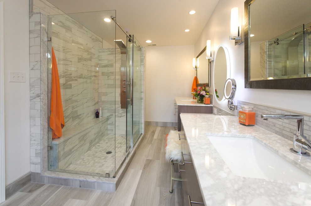 Design ideas for a small modern ensuite bathroom in Philadelphia with flat-panel cabinets, grey cabinets, a corner shower, a two-piece toilet, grey tiles, porcelain tiles, white walls, porcelain flooring, a submerged sink, engineered stone worktops, grey floors, a sliding door and grey worktops.