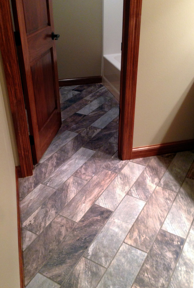 Inspiration for a mid-sized transitional 3/4 ceramic tile and gray floor bathroom remodel in Other with beige walls