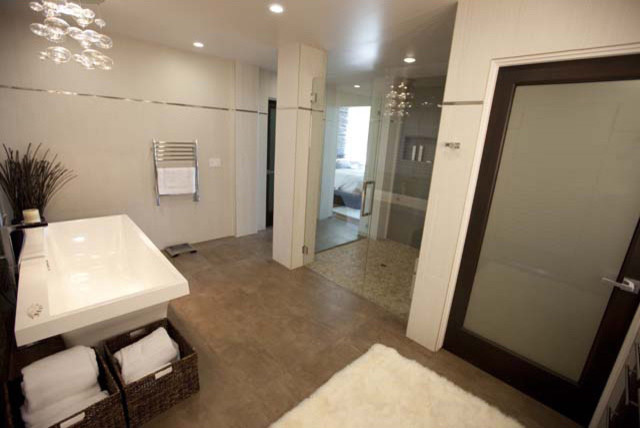 Inspiration for a large contemporary ensuite bathroom in San Luis Obispo with beige walls, ceramic flooring, a freestanding bath and a corner shower.
