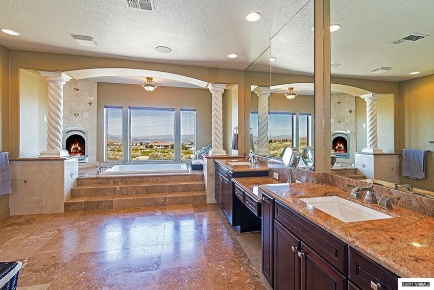 Photo of an expansive mediterranean ensuite bathroom in Other with a built-in sink, dark wood cabinets, granite worktops, a hot tub, beige tiles, beige walls and porcelain flooring.