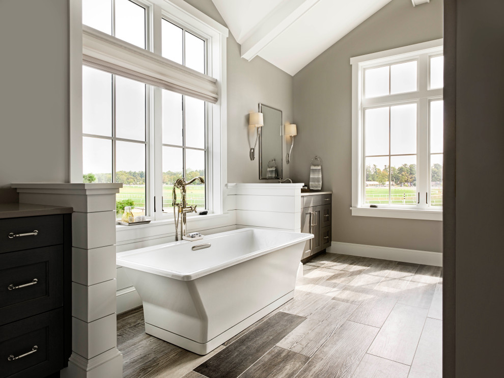 Inspiration for a large classic ensuite bathroom with dark wood cabinets, a freestanding bath, a walk-in shower, a two-piece toilet, grey walls, porcelain flooring, a submerged sink, quartz worktops, a hinged door, brown worktops, double sinks and a freestanding vanity unit.