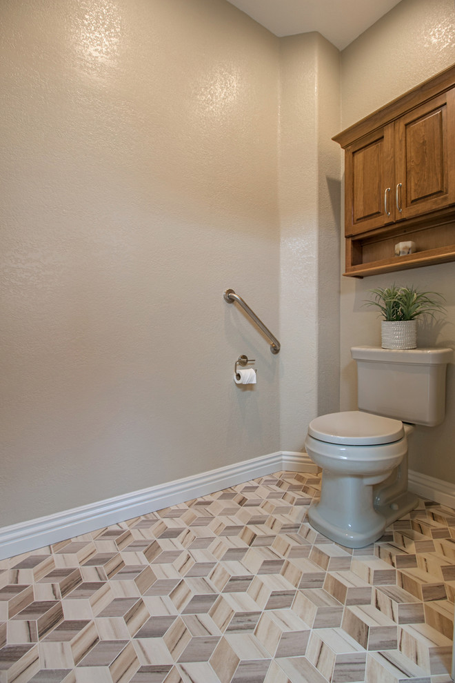 Inspiration for a large transitional master gray tile and ceramic tile ceramic tile doorless shower remodel in San Diego with raised-panel cabinets, medium tone wood cabinets, a one-piece toilet, black walls, an undermount sink and quartzite countertops