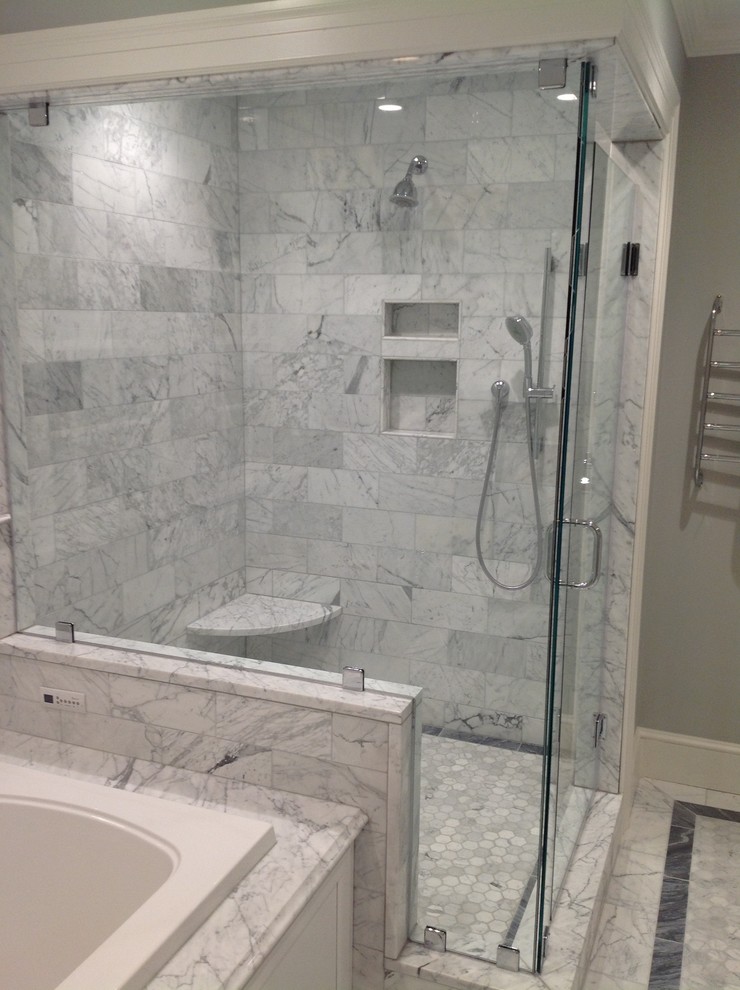 Inspiration for a mid-sized timeless master white tile and stone tile marble floor corner shower remodel in Boston with an undermount sink, recessed-panel cabinets, white cabinets, marble countertops, an undermount tub and a two-piece toilet