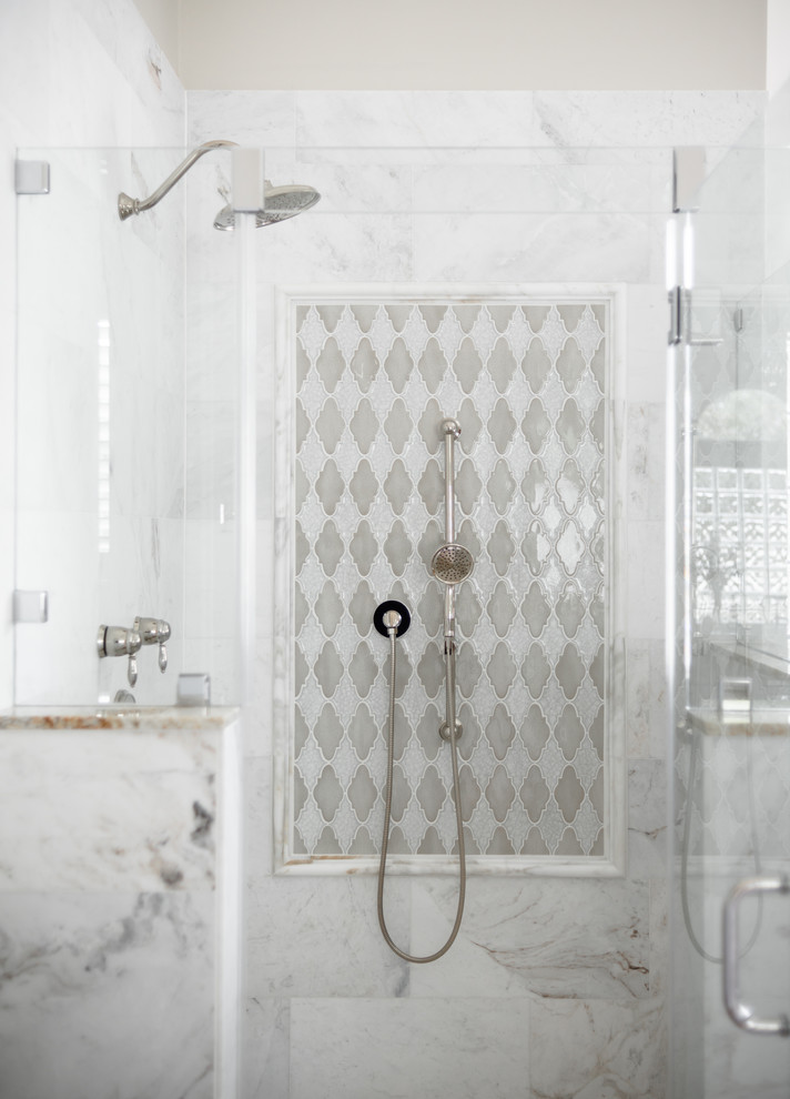 Bathroom - mid-sized transitional master white tile and marble tile porcelain tile and beige floor bathroom idea in Houston with raised-panel cabinets, beige cabinets, beige walls, an undermount sink, granite countertops, a hinged shower door and multicolored countertops