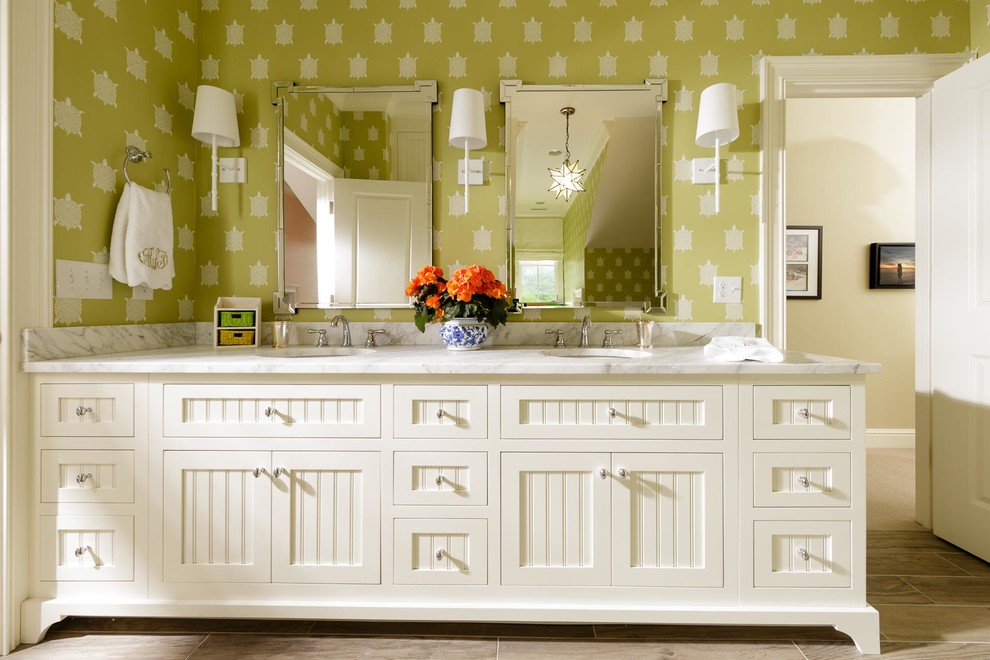 Example of a large transitional kids' bathroom design in Nashville with furniture-like cabinets, white cabinets, green walls, an undermount sink and marble countertops