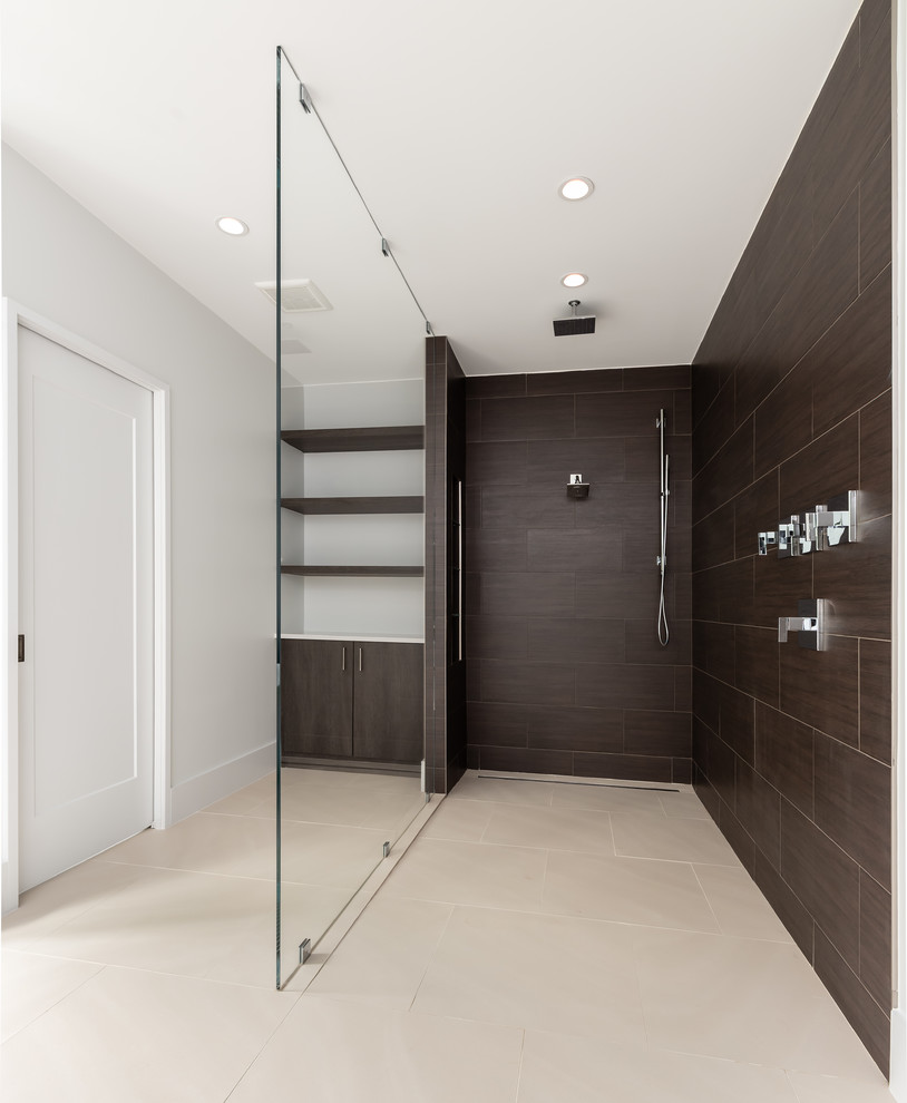 Design ideas for a large modern ensuite bathroom in DC Metro with flat-panel cabinets, white cabinets, a freestanding bath, a built-in shower, a one-piece toilet, brown tiles, porcelain tiles, white walls, porcelain flooring, a vessel sink, engineered stone worktops, beige floors, an open shower and white worktops.