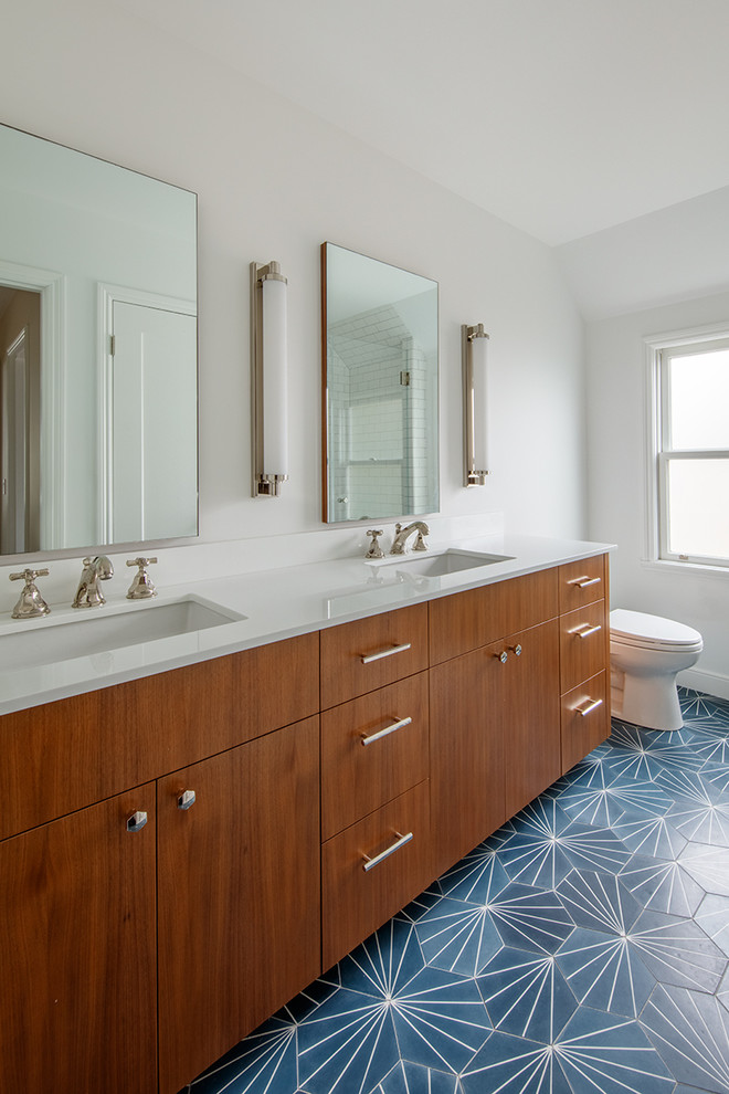 Inspiration for a small contemporary master white tile and ceramic tile cement tile floor and blue floor alcove shower remodel in San Francisco with flat-panel cabinets, dark wood cabinets, a one-piece toilet, white walls, an undermount sink, quartz countertops and a hinged shower door