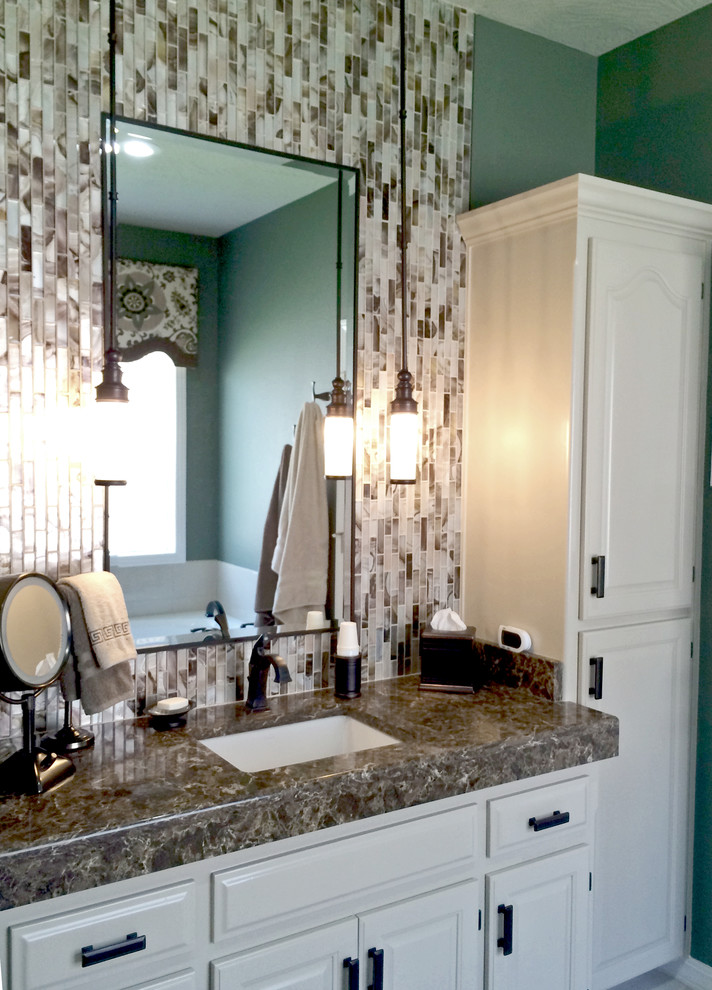 Example of a mid-sized transitional master multicolored tile ceramic tile doorless shower design in Other with an undermount sink, quartz countertops, green walls, raised-panel cabinets and white cabinets