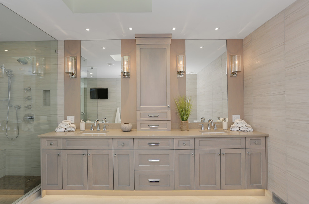 Design ideas for a medium sized contemporary ensuite bathroom in Vancouver with beige walls, shaker cabinets, light wood cabinets, a freestanding bath, a corner shower, a two-piece toilet, beige tiles, porcelain tiles, ceramic flooring, a submerged sink, granite worktops, beige floors and a hinged door.