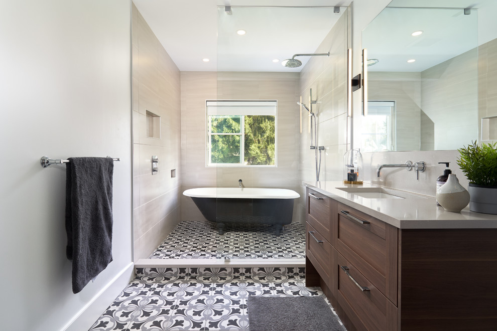 Photo of a classic wet room bathroom in Vancouver with shaker cabinets, dark wood cabinets, a freestanding bath, beige tiles, white walls, a submerged sink, multi-coloured floors, grey worktops and an open shower.