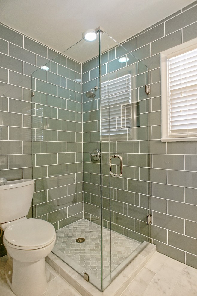 Small traditional ensuite bathroom in Dallas with a corner shower, a one-piece toilet, white walls, marble flooring, freestanding cabinets, dark wood cabinets, grey tiles, glass tiles, a submerged sink, marble worktops and grey floors.