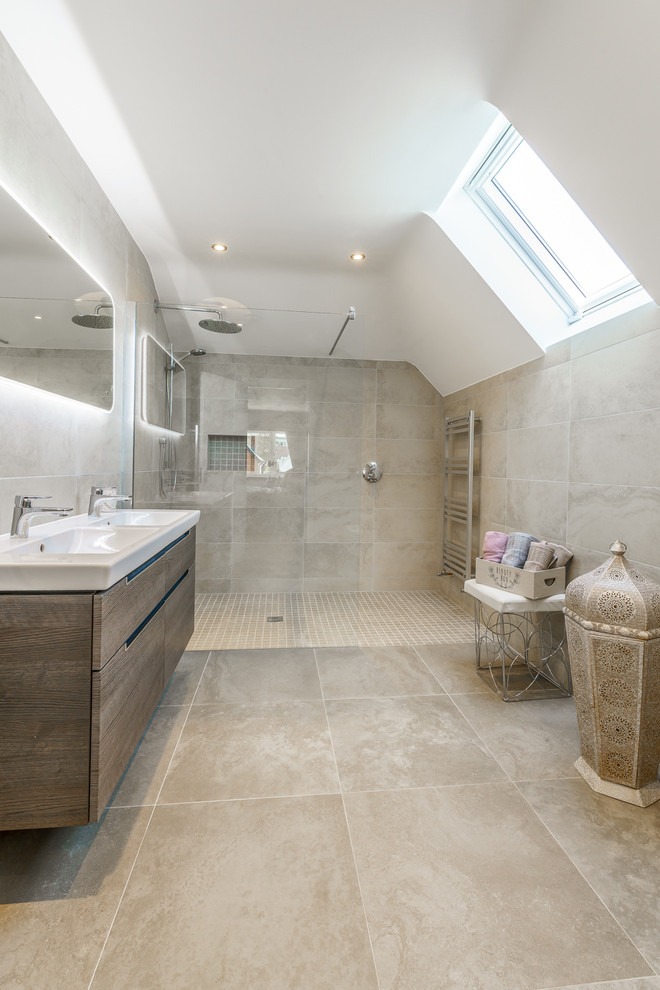 This is an example of a contemporary ensuite bathroom in Dublin with flat-panel cabinets, medium wood cabinets, a built-in shower, beige tiles, white walls, a console sink, beige floors, an open shower and white worktops.