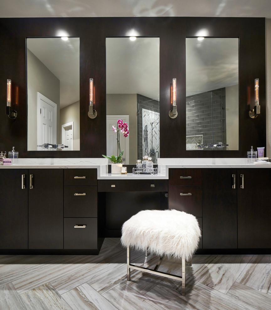 Freestanding bathtub - mid-sized contemporary master gray tile and ceramic tile marble floor and white floor freestanding bathtub idea in Austin with flat-panel cabinets, dark wood cabinets, a one-piece toilet, gray walls, an undermount sink, quartz countertops and a hinged shower door