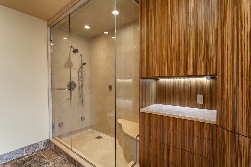 Photo of a medium sized traditional sauna bathroom in Denver with freestanding cabinets, light wood cabinets, granite worktops, beige tiles, stone tiles, a two-piece toilet, a submerged sink, beige walls and travertine flooring.