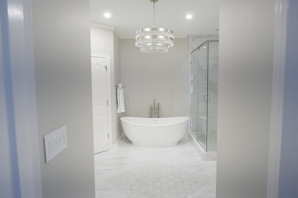 Design ideas for a large classic ensuite bathroom in Other with shaker cabinets, white cabinets, a freestanding bath, a corner shower, a two-piece toilet, white tiles, porcelain tiles, beige walls, porcelain flooring, a submerged sink, marble worktops, white floors, a hinged door and white worktops.