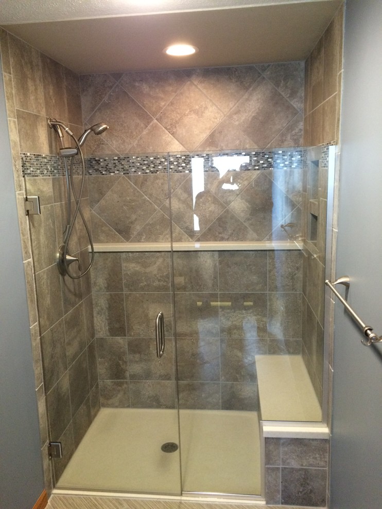 Medium sized contemporary ensuite bathroom in Wichita with a built-in shower, grey tiles, ceramic tiles, grey walls, ceramic flooring and onyx worktops.