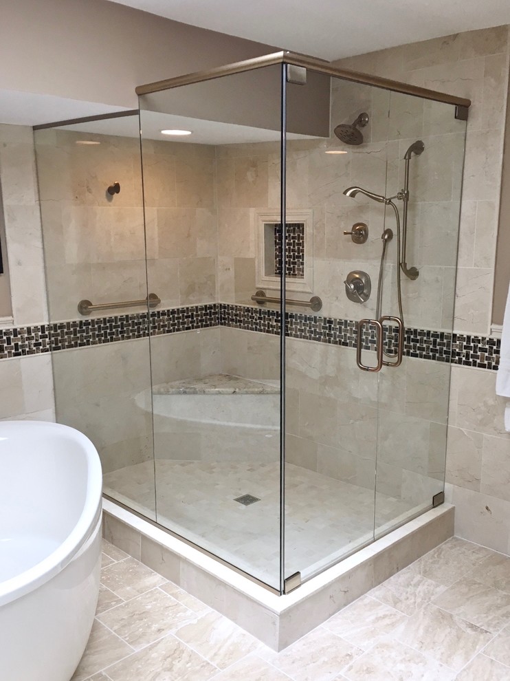 Example of a large transitional master beige tile alcove shower design in Other with a hinged shower door