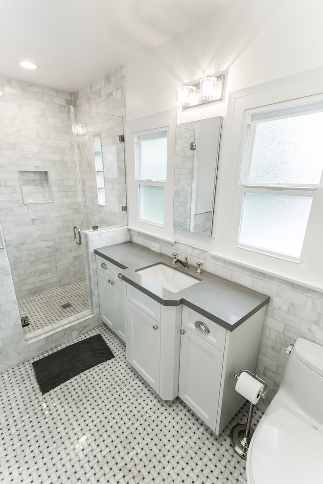 Inspiration for an expansive modern shower room bathroom in Los Angeles with a built-in sink, shaker cabinets, white cabinets, granite worktops, a freestanding bath, a corner shower, a one-piece toilet, white tiles, metro tiles, white walls and porcelain flooring.