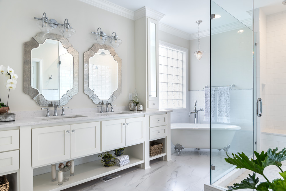 Claw-foot bathtub - transitional ceramic tile porcelain tile and white floor claw-foot bathtub idea in Nashville with white cabinets, white walls, an undermount sink, quartz countertops, a hinged shower door, white countertops and shaker cabinets