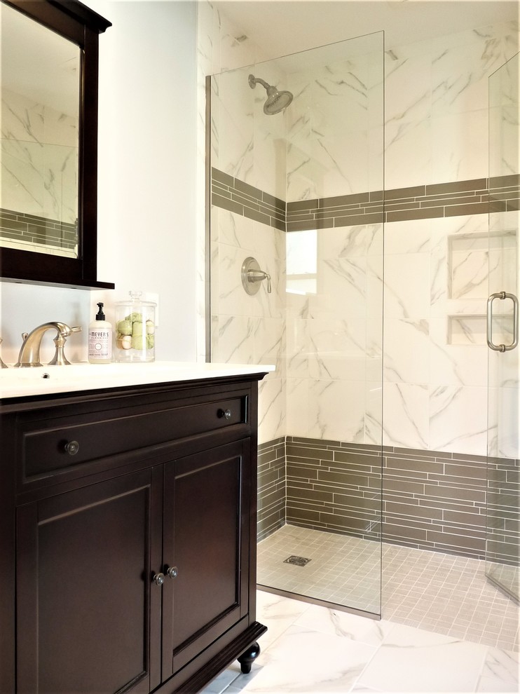 Mid-sized eclectic 3/4 gray tile, white tile and marble tile marble floor and white floor alcove shower photo in Philadelphia with furniture-like cabinets, dark wood cabinets, an undermount sink, quartz countertops, a two-piece toilet, gray walls and a hinged shower door