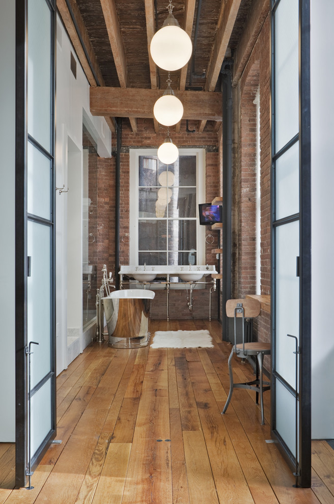 Large urban master red tile medium tone wood floor and brown floor bathroom photo in New York with marble countertops, a console sink, red walls, open cabinets and medium tone wood cabinets