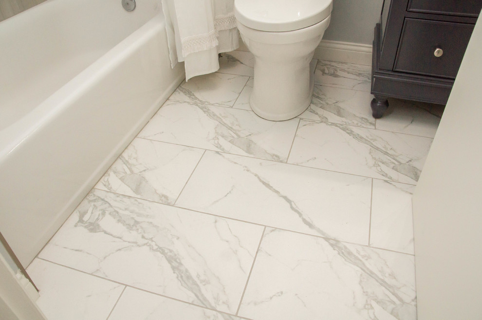 Example of a small transitional 3/4 beige tile and ceramic tile marble floor and white floor bathroom design in Louisville with recessed-panel cabinets, dark wood cabinets, a two-piece toilet, gray walls, an undermount sink and marble countertops