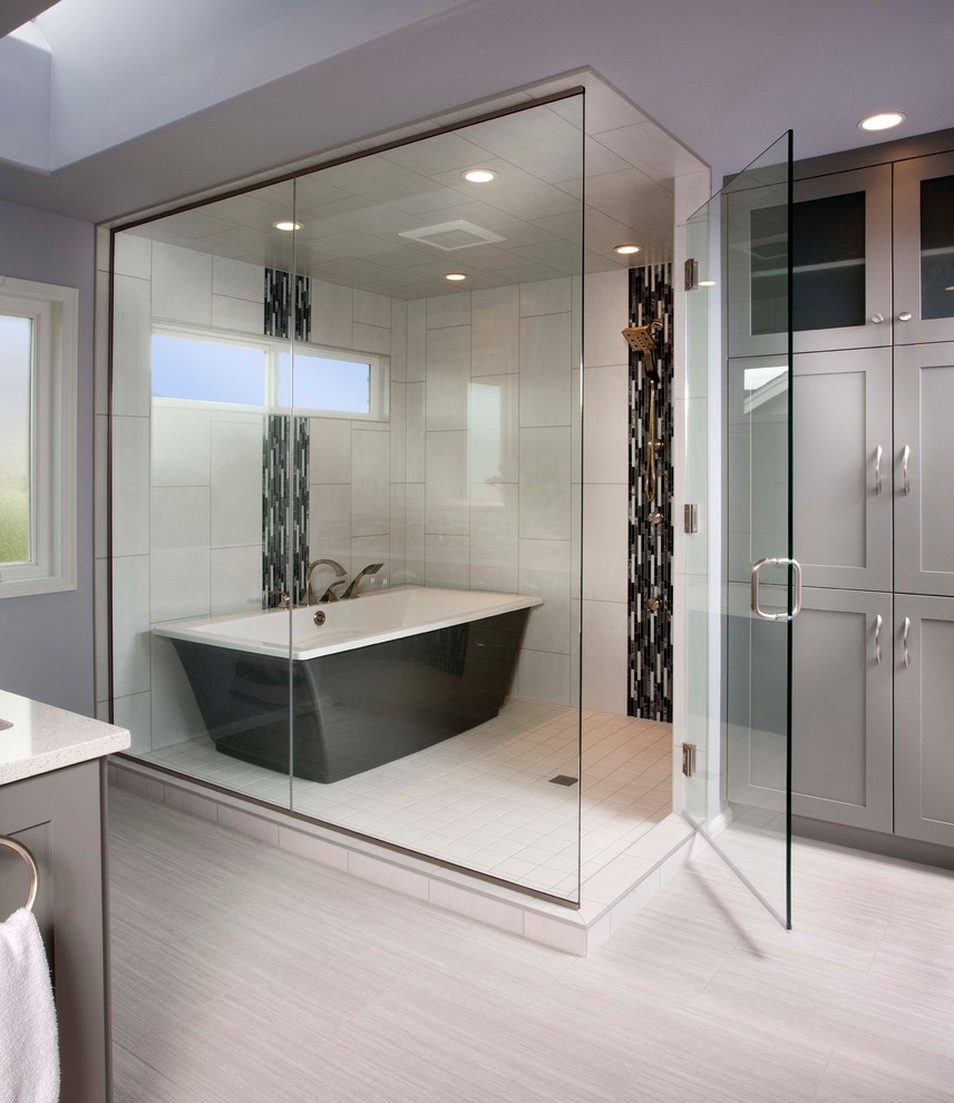 Example of a mid-sized minimalist master freestanding bathtub design in Kansas City