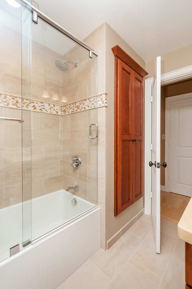 Example of a mid-sized arts and crafts 3/4 beige tile and porcelain tile porcelain tile and beige floor bathroom design in San Francisco with an undermount sink, light wood cabinets, quartzite countertops, a one-piece toilet, beige walls, recessed-panel cabinets and a hinged shower door