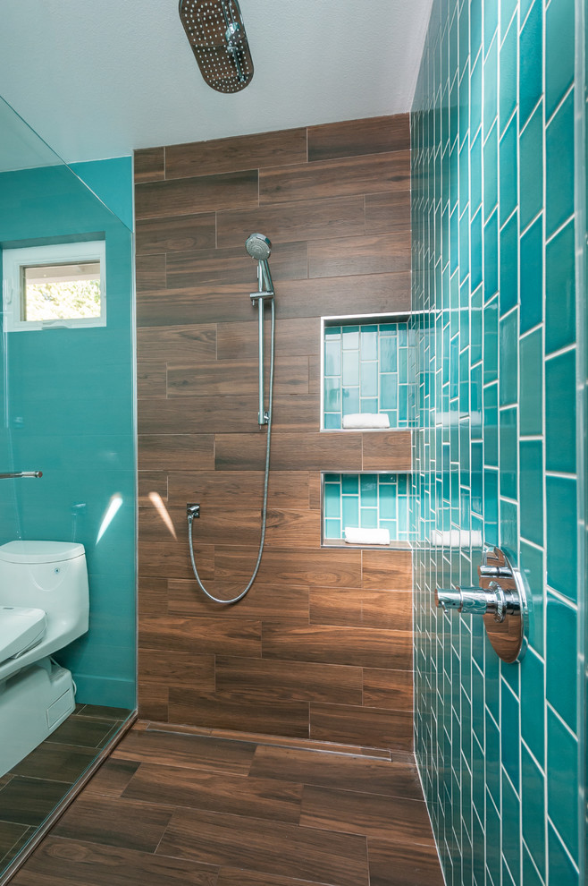 Inspiration for a mid-sized modern master green tile and ceramic tile porcelain tile walk-in shower remodel in San Francisco with flat-panel cabinets, medium tone wood cabinets, a one-piece toilet, white walls, an undermount sink and quartz countertops