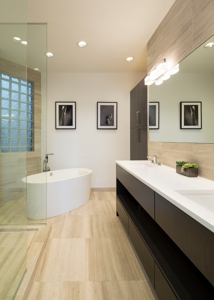 This is an example of a large contemporary ensuite bathroom in Chicago with open cabinets, dark wood cabinets, a freestanding bath, a corner shower, beige tiles, porcelain tiles, white walls, porcelain flooring, an integrated sink and engineered stone worktops.