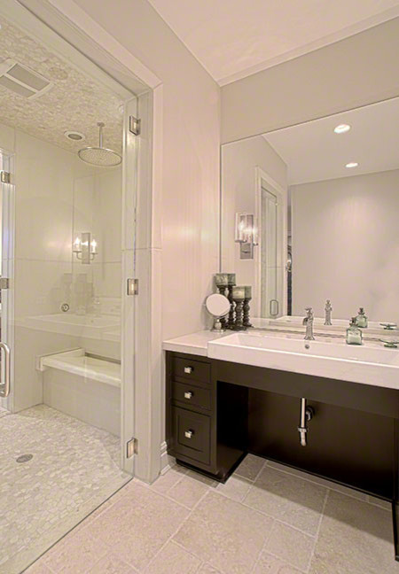 Example of a mid-sized classic master white tile and porcelain tile ceramic tile and beige floor alcove shower design in Chicago with flat-panel cabinets, dark wood cabinets, white walls, a trough sink, quartz countertops and a hinged shower door
