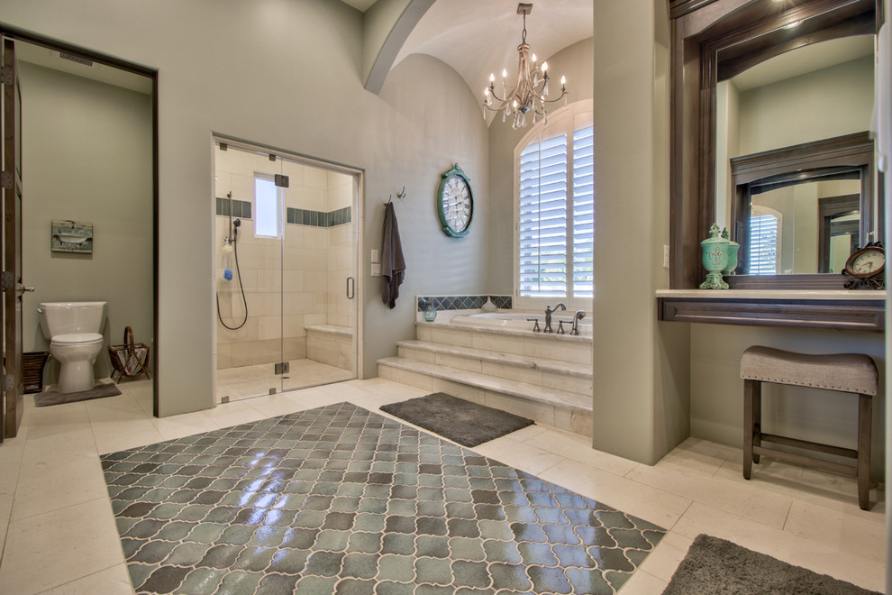 Huge elegant master beige tile and travertine tile travertine floor and beige floor bathroom photo in Phoenix with raised-panel cabinets, dark wood cabinets, a two-piece toilet, gray walls, an undermount sink and a hinged shower door