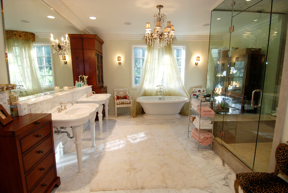 Classic bathroom in Los Angeles with a freestanding bath and a console sink.