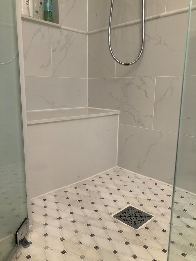Photo of a medium sized traditional bathroom in Toronto with freestanding cabinets, blue cabinets, a claw-foot bath, a built-in shower, white tiles, porcelain tiles, blue walls, porcelain flooring, engineered stone worktops, white floors, a hinged door and white worktops.