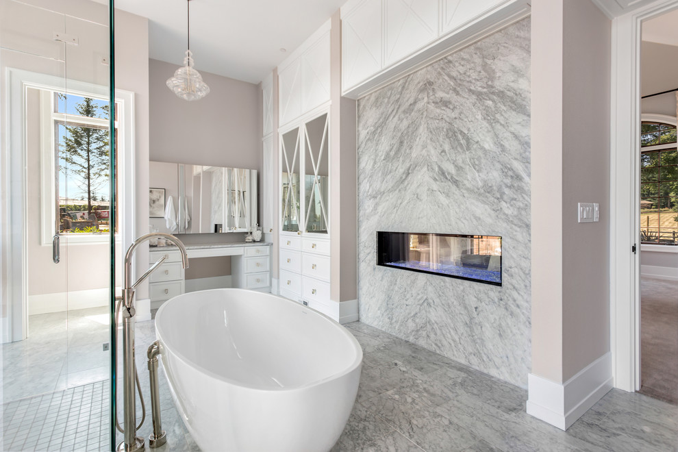 Huge transitional master marble floor bathroom photo in Portland with recessed-panel cabinets, white cabinets, a one-piece toilet, gray walls, an undermount sink and marble countertops