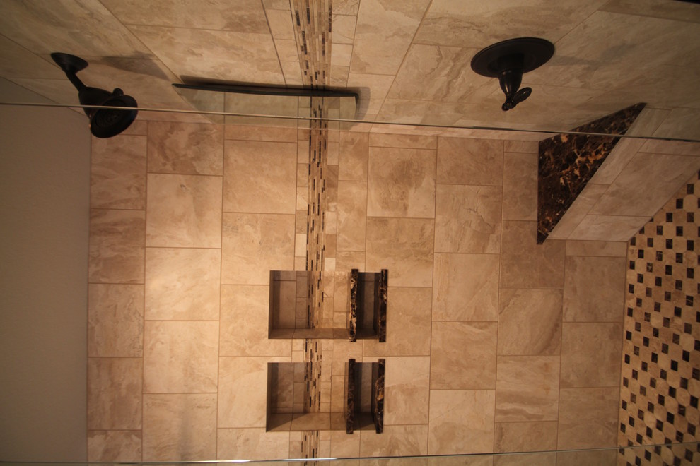 Inspiration for a large modern master travertine floor and beige floor corner shower remodel in Minneapolis with raised-panel cabinets, white cabinets, brown walls, an undermount sink, marble countertops, a hinged shower door and brown countertops