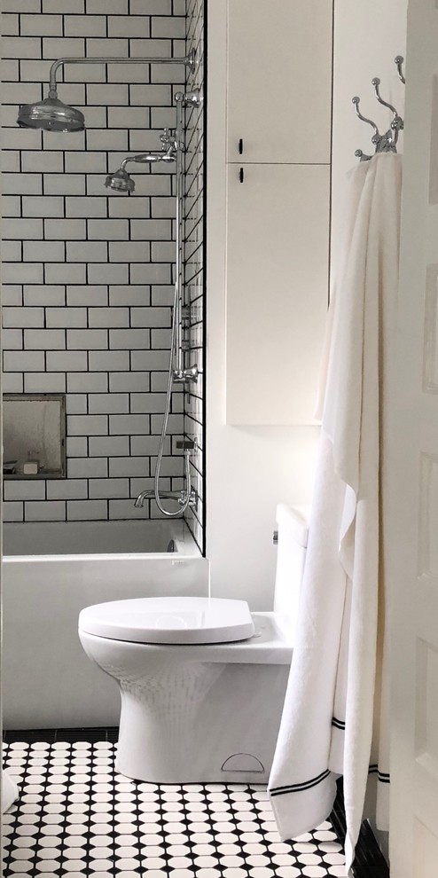 Inspiration for a mid-sized transitional master white tile and subway tile ceramic tile and multicolored floor bathroom remodel in Toronto with flat-panel cabinets, white cabinets, a one-piece toilet, white walls and glass countertops