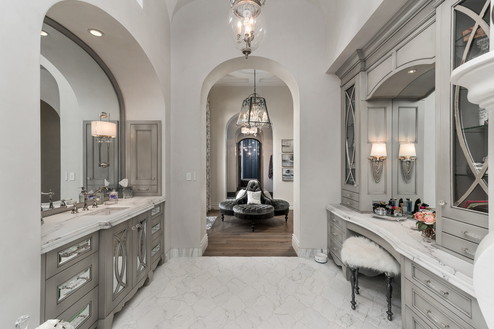 Bathroom - huge master multicolored tile and mirror tile porcelain tile and multicolored floor bathroom idea in Phoenix with gray cabinets, a one-piece toilet, white walls, a drop-in sink, quartzite countertops, a hinged shower door, multicolored countertops and recessed-panel cabinets