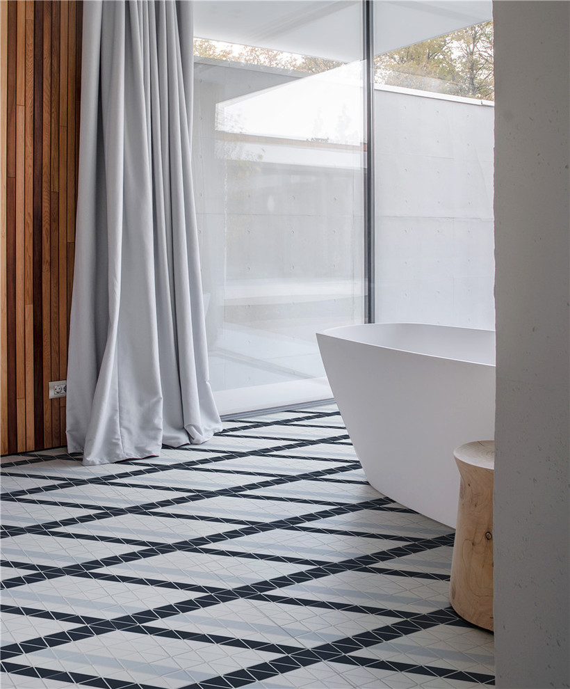 Inspiration pour une salle de bain design avec un sol en carrelage de porcelaine et un sol bleu.