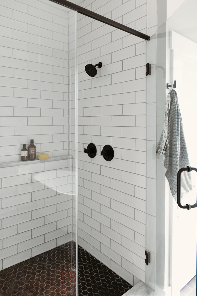 Bathroom - small contemporary master white tile and subway tile porcelain tile and black floor bathroom idea in Other with shaker cabinets, light wood cabinets, an undermount sink, quartzite countertops, a hinged shower door and white countertops