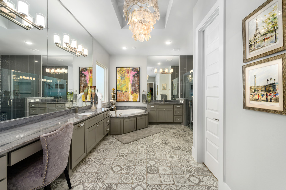 Example of a large transitional master gray tile and ceramic tile cement tile floor and gray floor drop-in bathtub design in Houston with shaker cabinets, gray cabinets, gray walls, an undermount sink, granite countertops and gray countertops