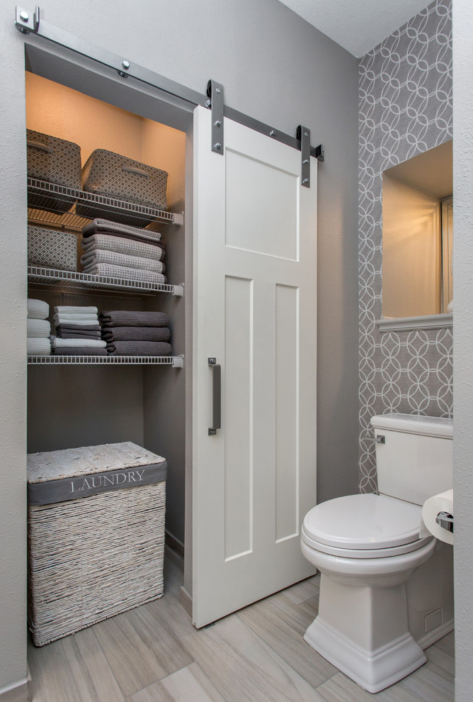This is an example of a medium sized classic ensuite bathroom in Other with recessed-panel cabinets, white cabinets, a double shower, a two-piece toilet, grey tiles, ceramic tiles, grey walls, ceramic flooring, a submerged sink, engineered stone worktops, grey floors and an open shower.