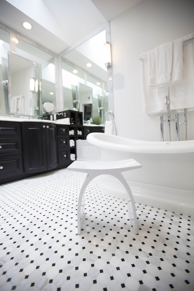 Bathroom - mid-sized traditional master black and white tile and stone tile marble floor bathroom idea in St Louis with raised-panel cabinets, black cabinets, a two-piece toilet, white walls, an undermount sink and marble countertops