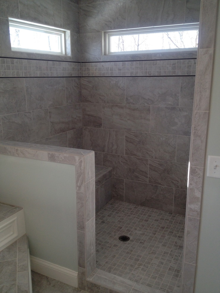 Example of a large classic master beige tile and ceramic tile ceramic tile bathroom design in Cincinnati with recessed-panel cabinets, medium tone wood cabinets, a one-piece toilet, green walls, an undermount sink and granite countertops